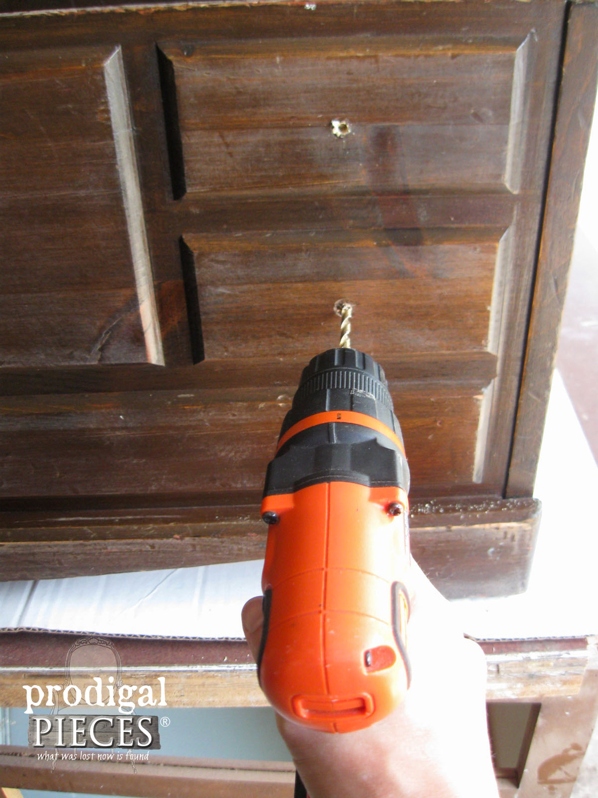 Drilling New Knob Holes with Cordless Drill for DIY Wooden Chest | prodigalpieces.com