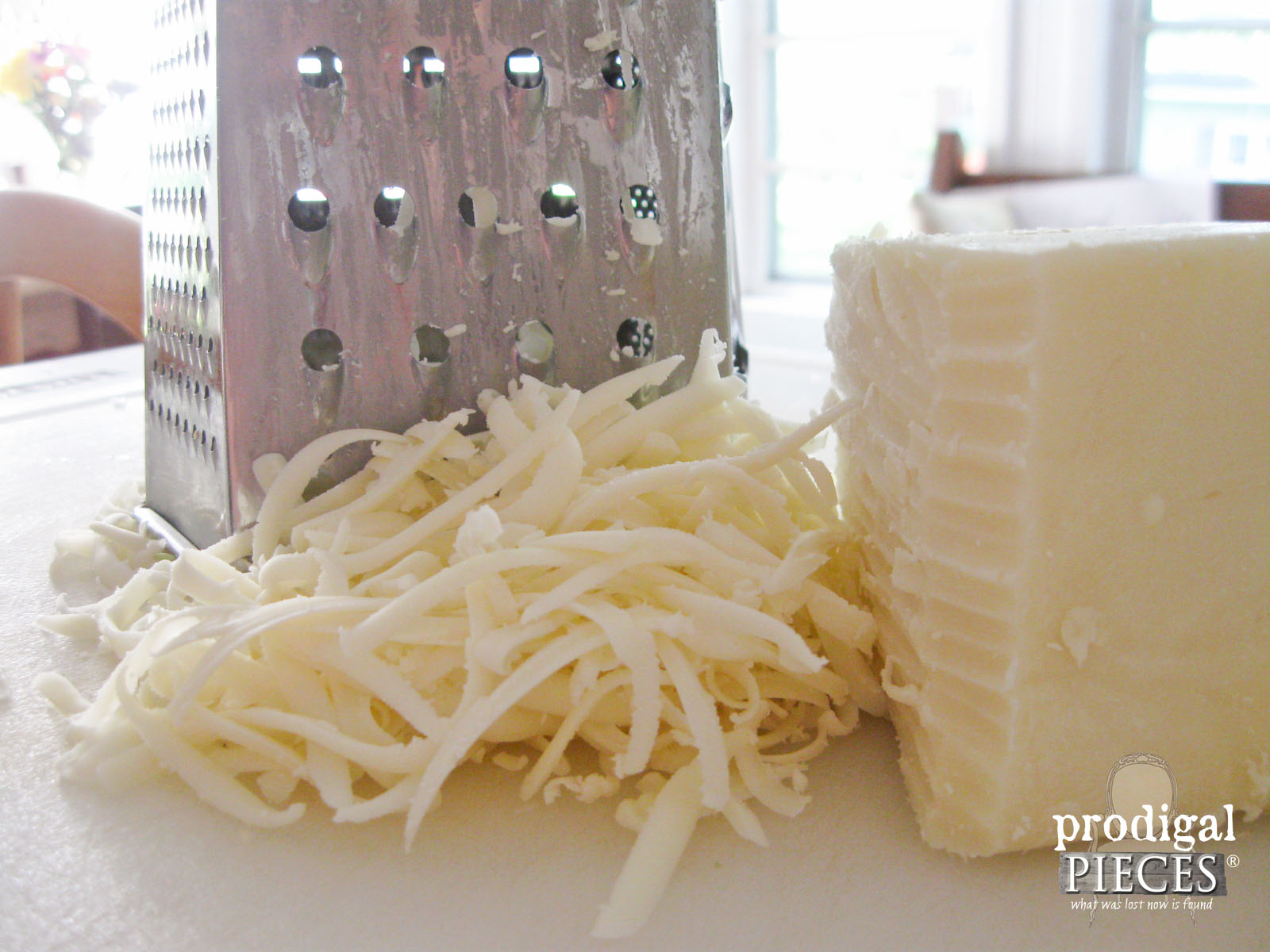 Grating Locally Raised and Cured Mozarella Cheese | Prodigal Pieces | www.prodigalpieces.com