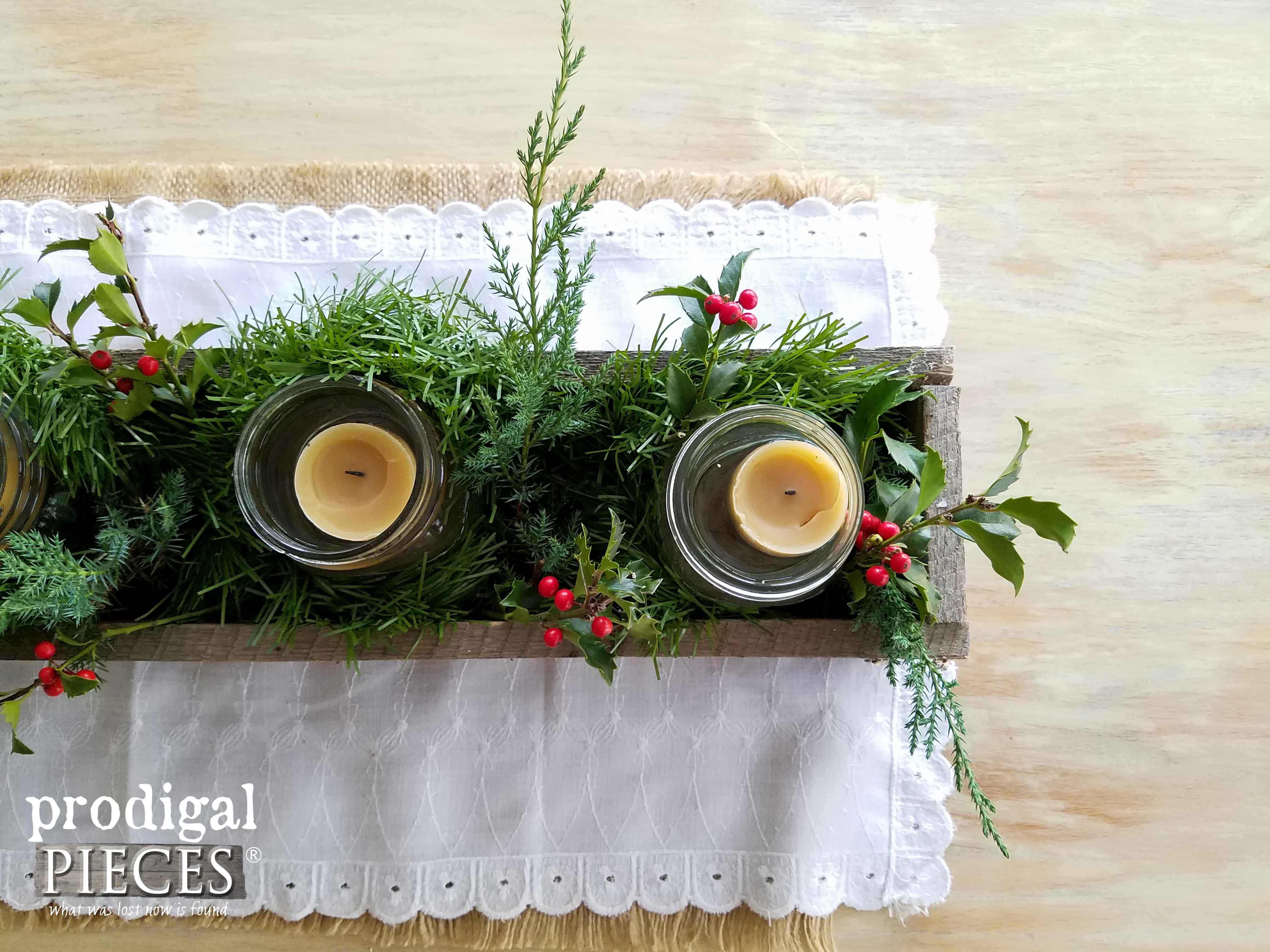 Simple Christmas Centerpiece with Pine and Holly, and Beeswax Candles in a Reclaimed Wood Trough by Prodigal Pieces | www.prodigalpieces.com