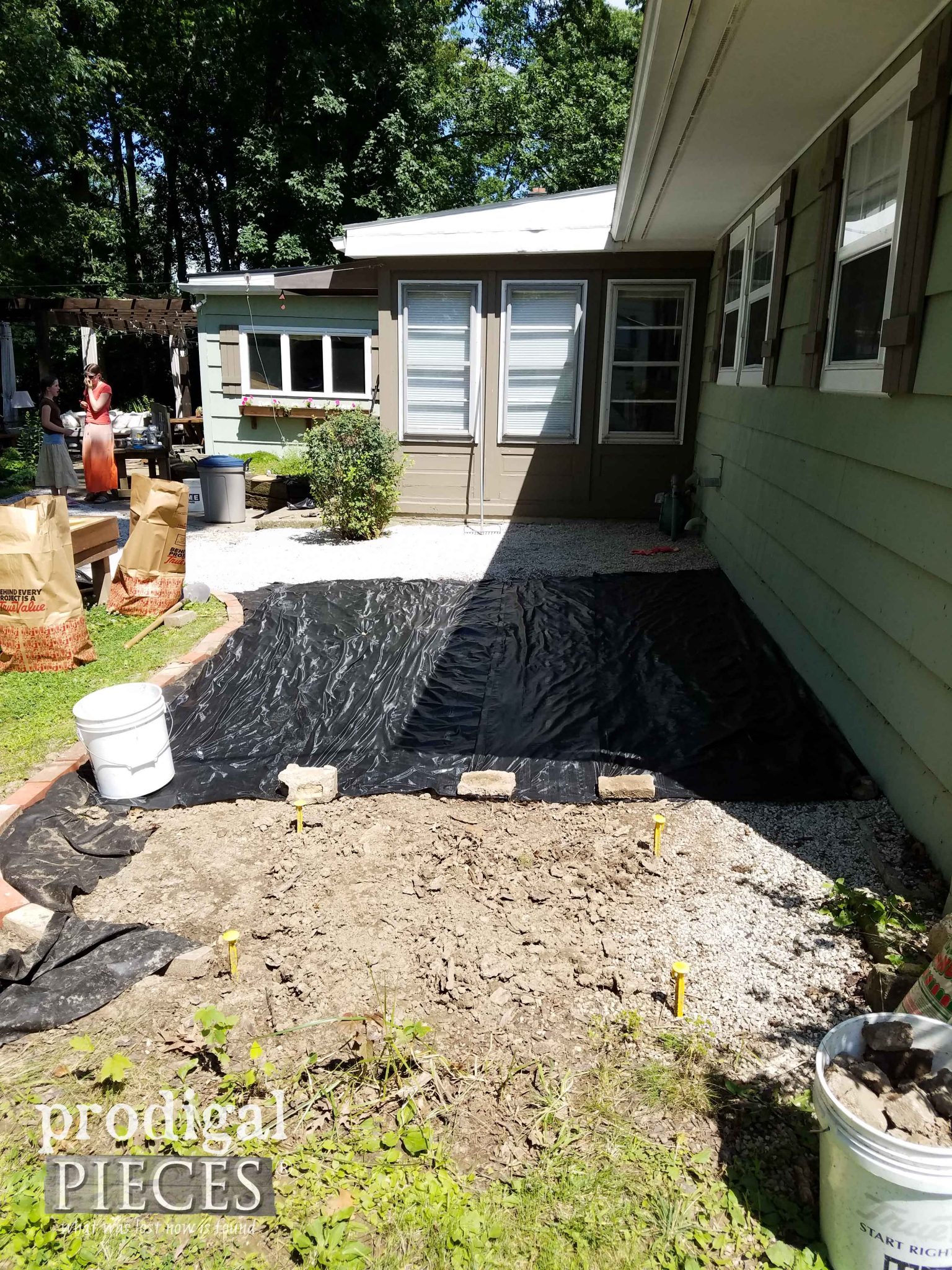 Laying Down Gravel for Outdoor Play Area | prodigalpieces.com