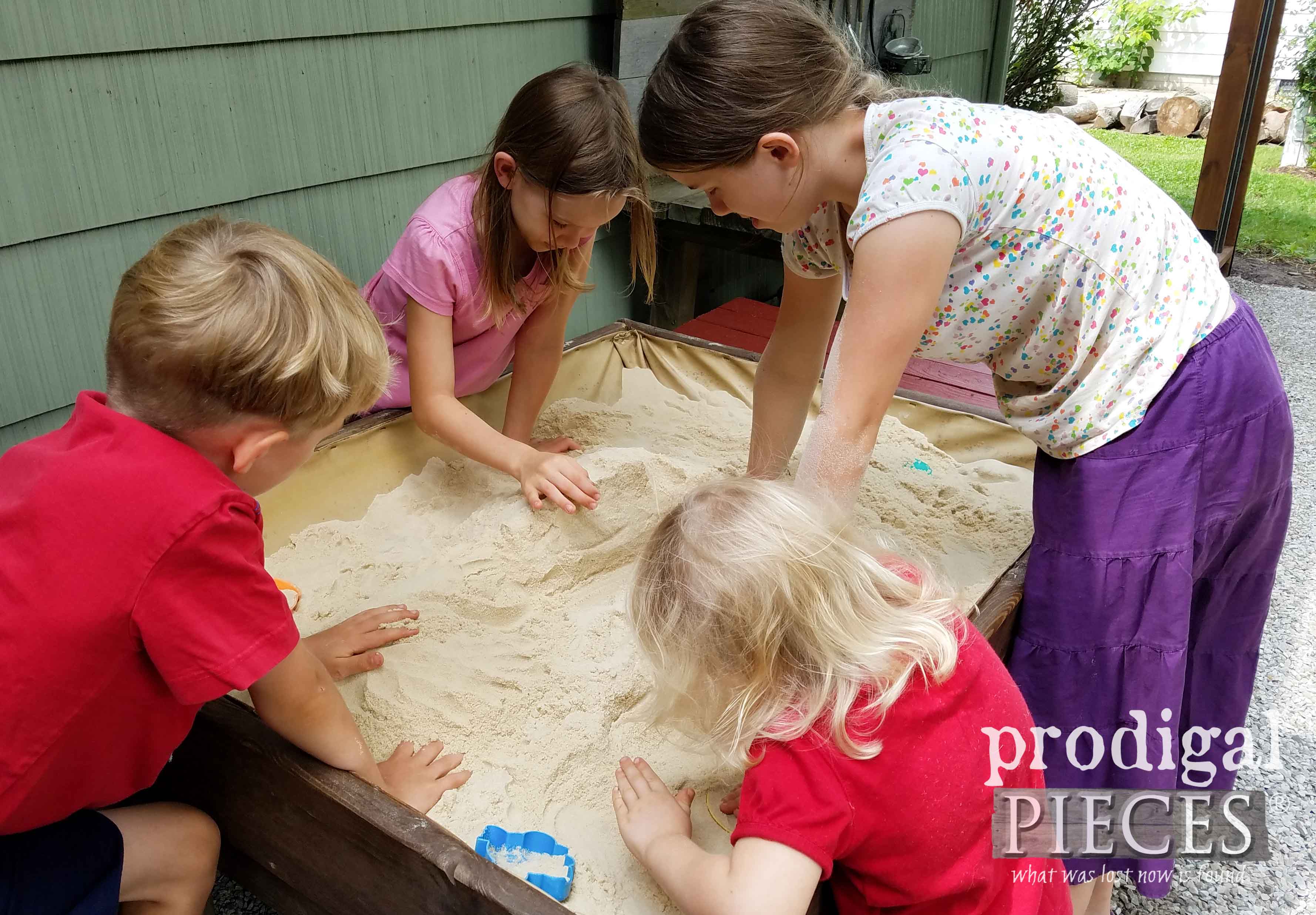 Kids playing in DIY Sand Table by Prodigal Pieces | prodigalpieces.com
