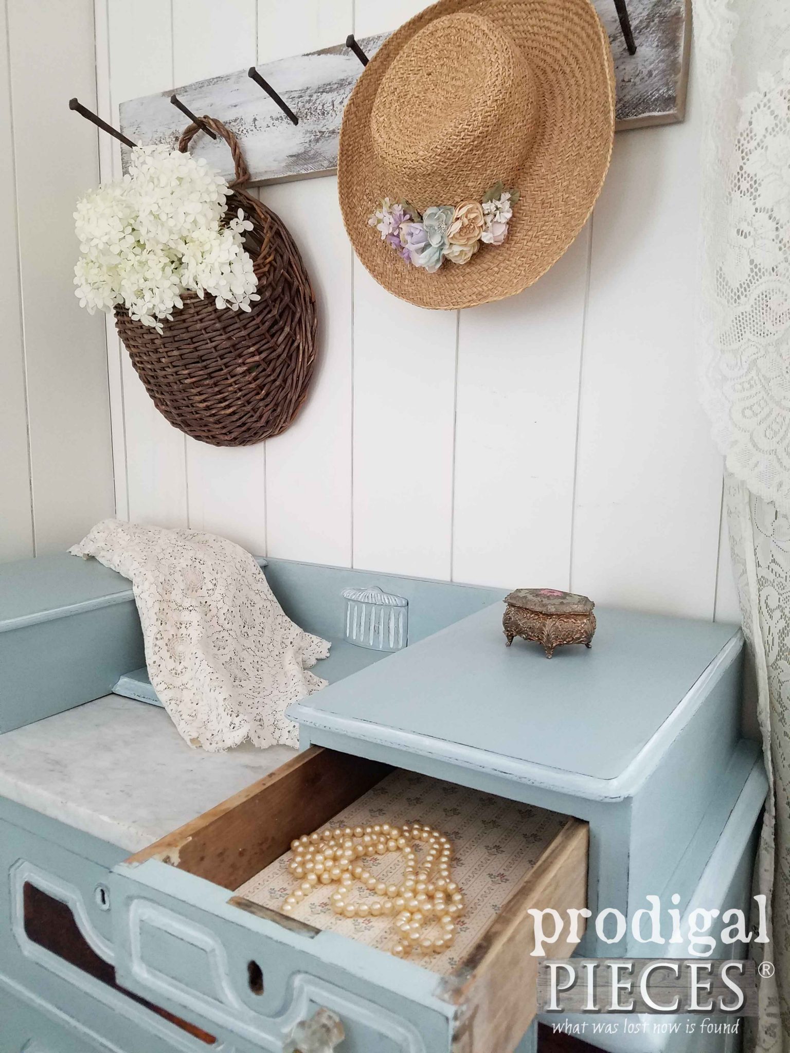Vignette with Antique Chest, Limelight Hydrangeas, Old Pearl Necklace, and Straw Hat by Prodigal Pieces | prodigalpieces.ccom