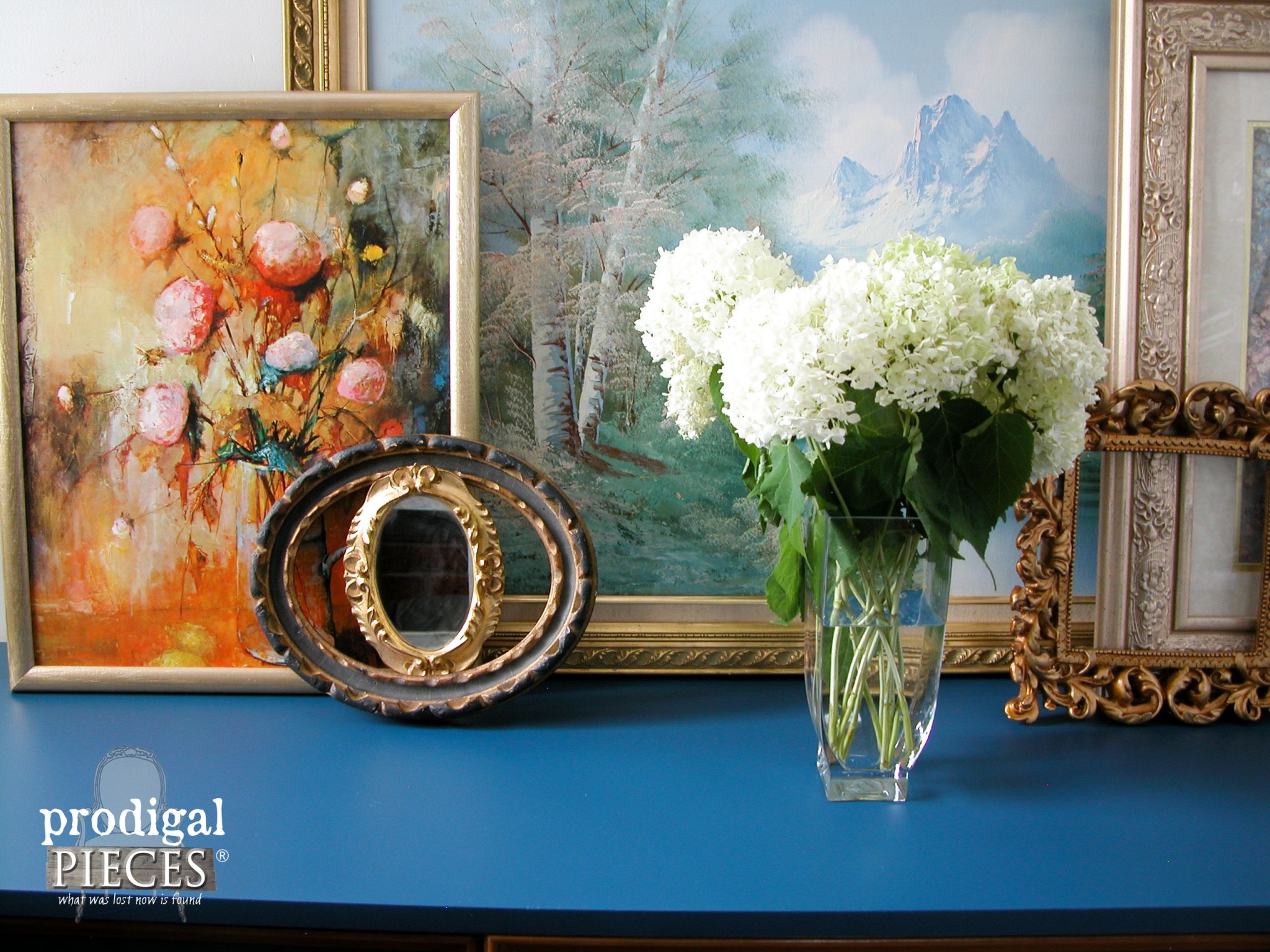 Hydrangea and Eclectic Picture Frames Vignette on Blue Dresser by Prodigal Pieces | www.prodigalpieces.com