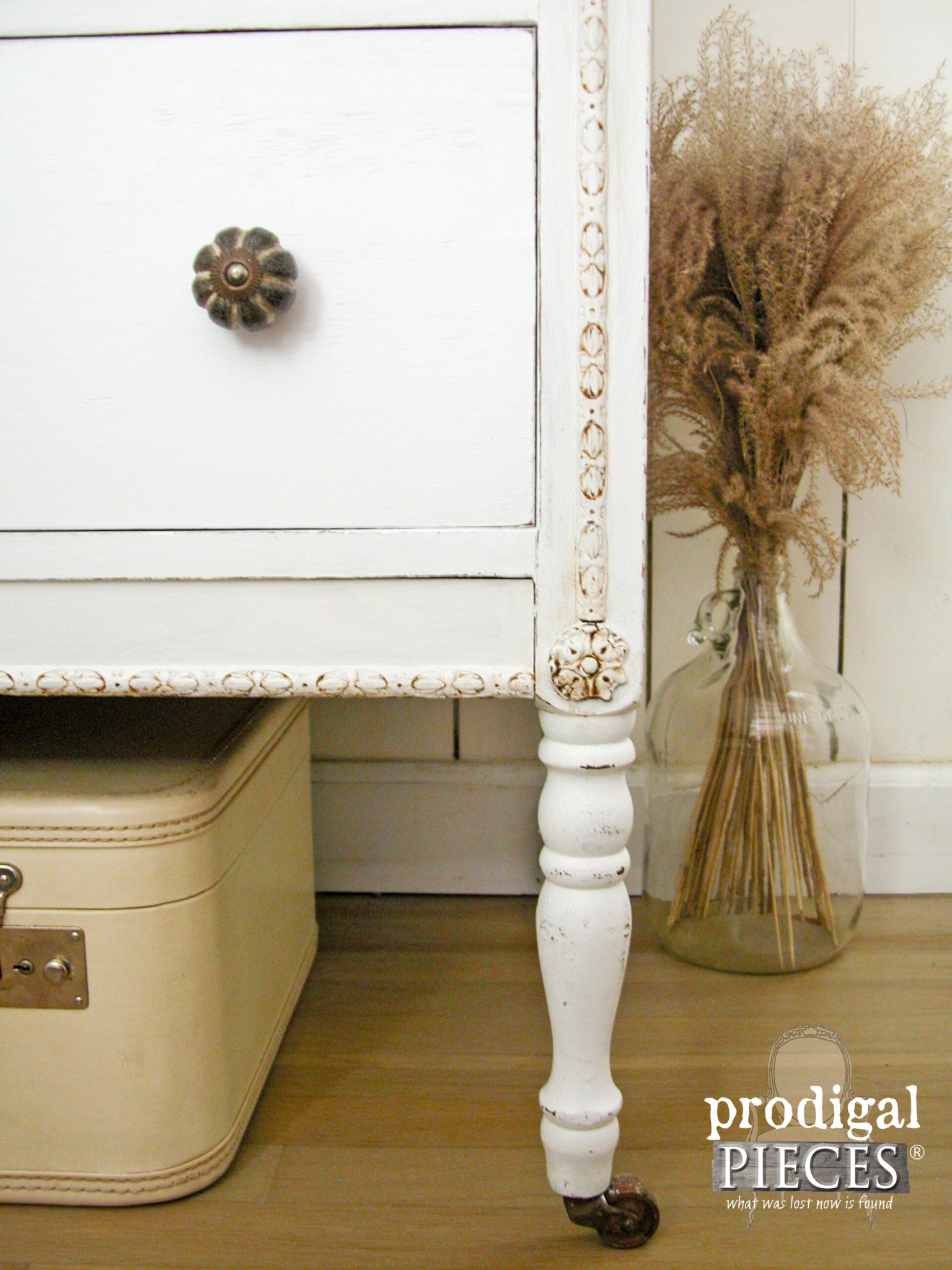 Ornate Details Drawn Our with Dark Wax and Feature Rustic Brands Knobs by Prodigal Pieces | www.prodigalpieces.com