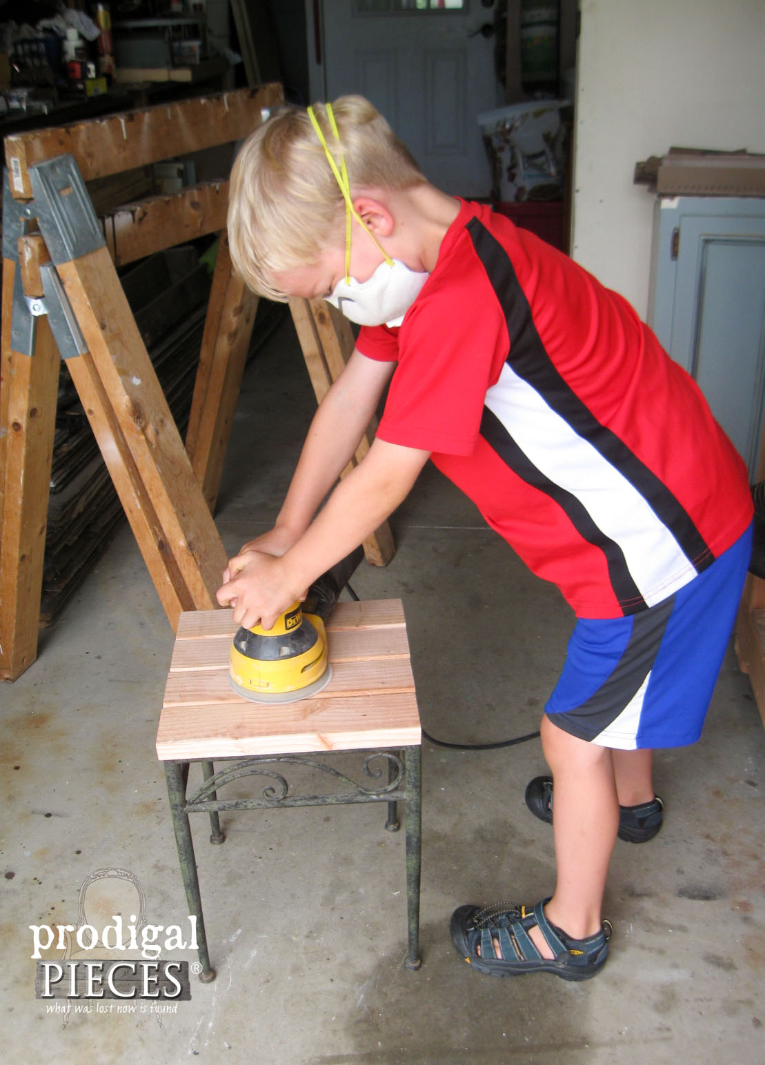 Boy Sanding Outdoor Table Top | Prodigal Pieces | www.prodigalpieces.com