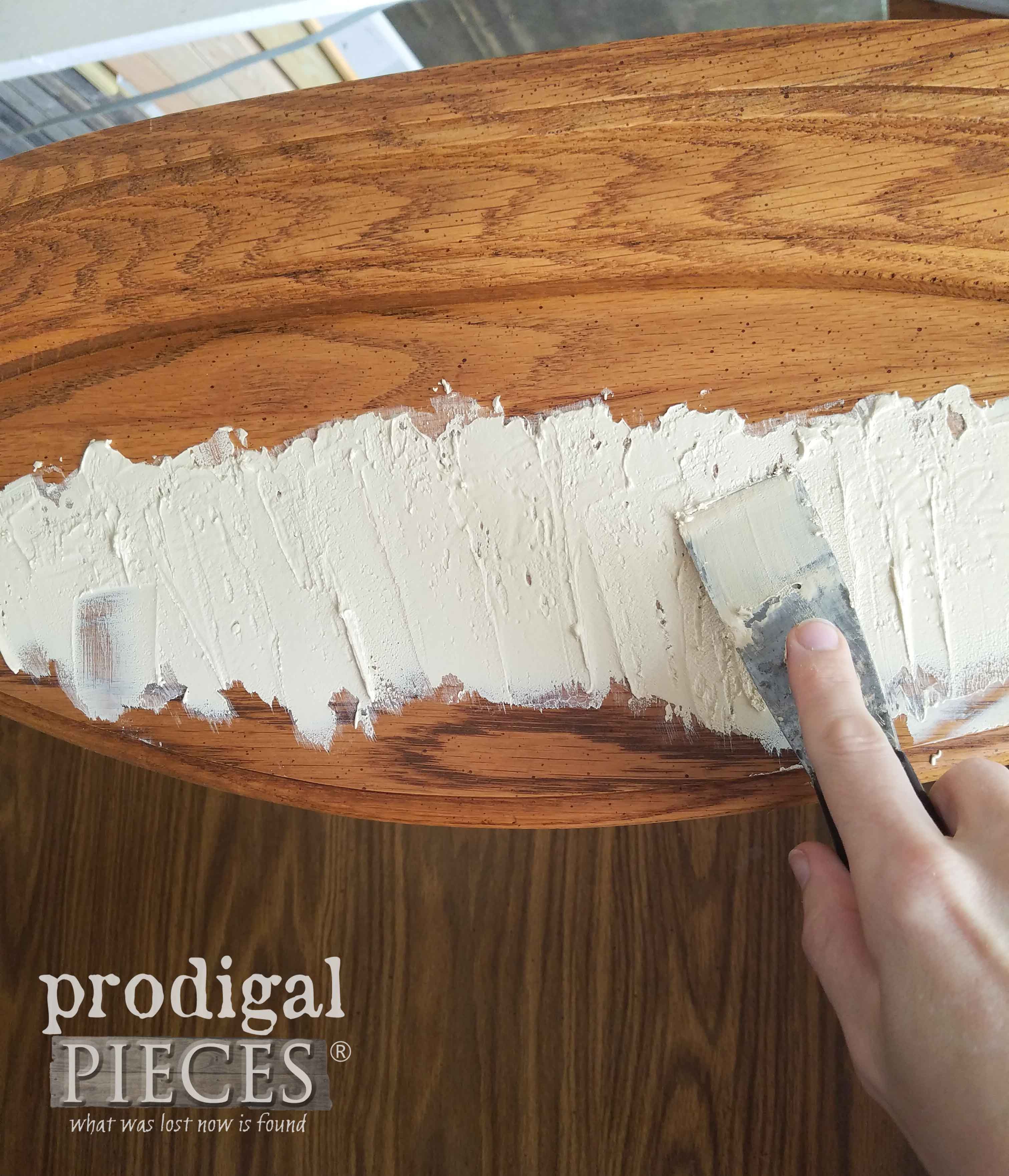 Applying wood filler to Broyhill hutch desk | prodigalpieces.com