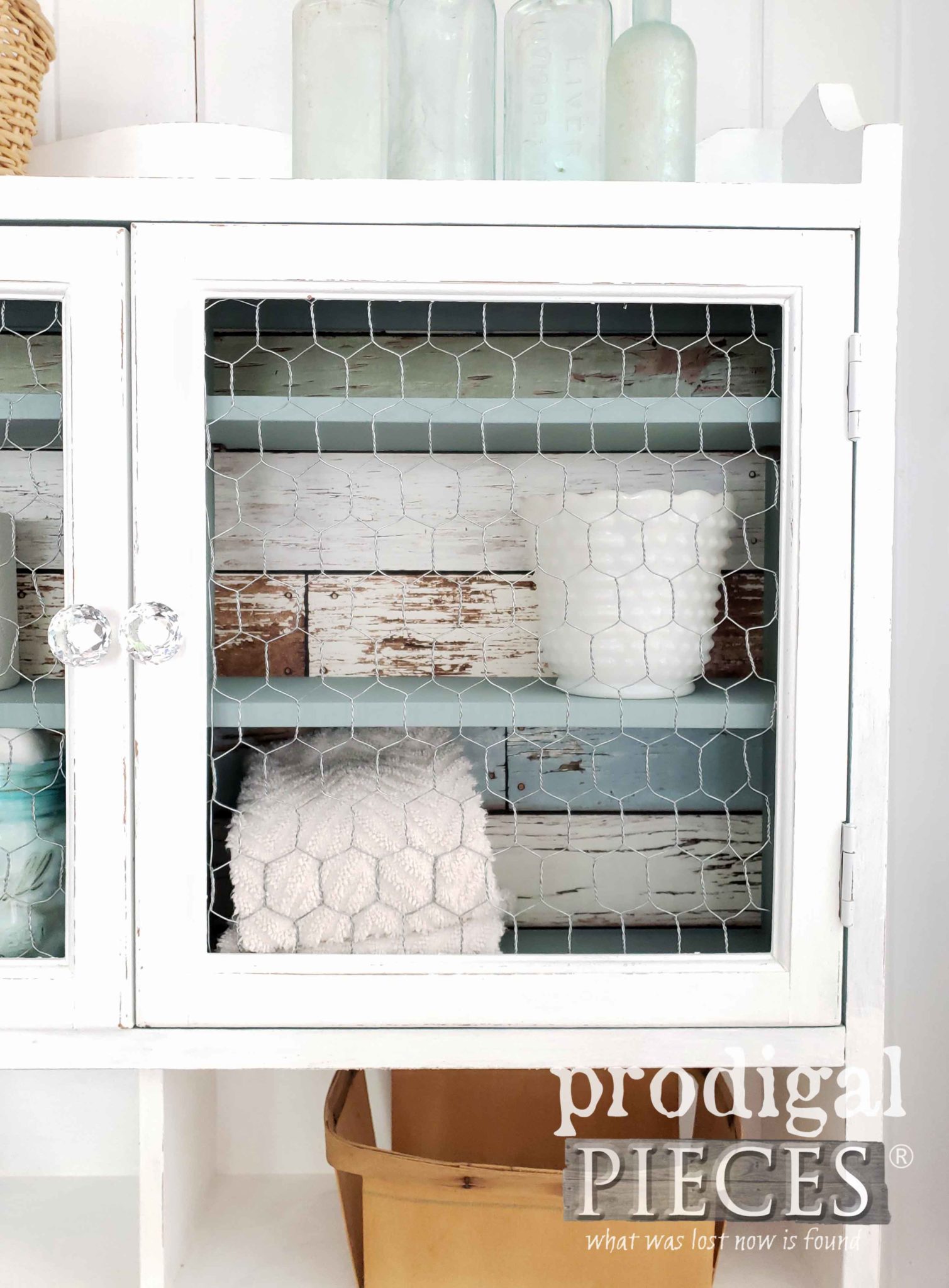 Farmhouse Chic Wall Cupboard in White with Chicken Wire Doors by Prodigal Pieces | prodigalpieces.com