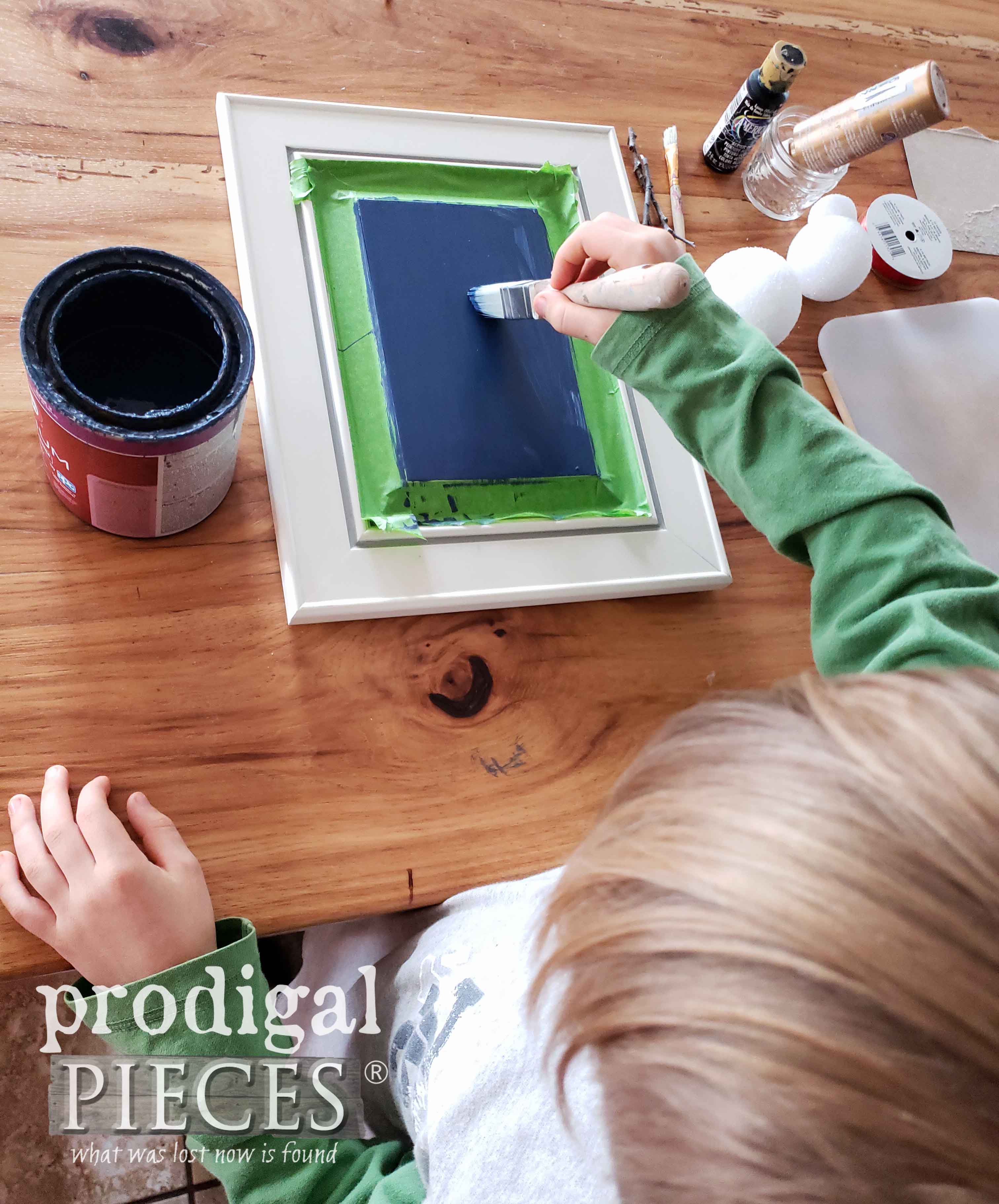 Boy Painting Christmas Cupboard Door Craft | prodigalpieces.com