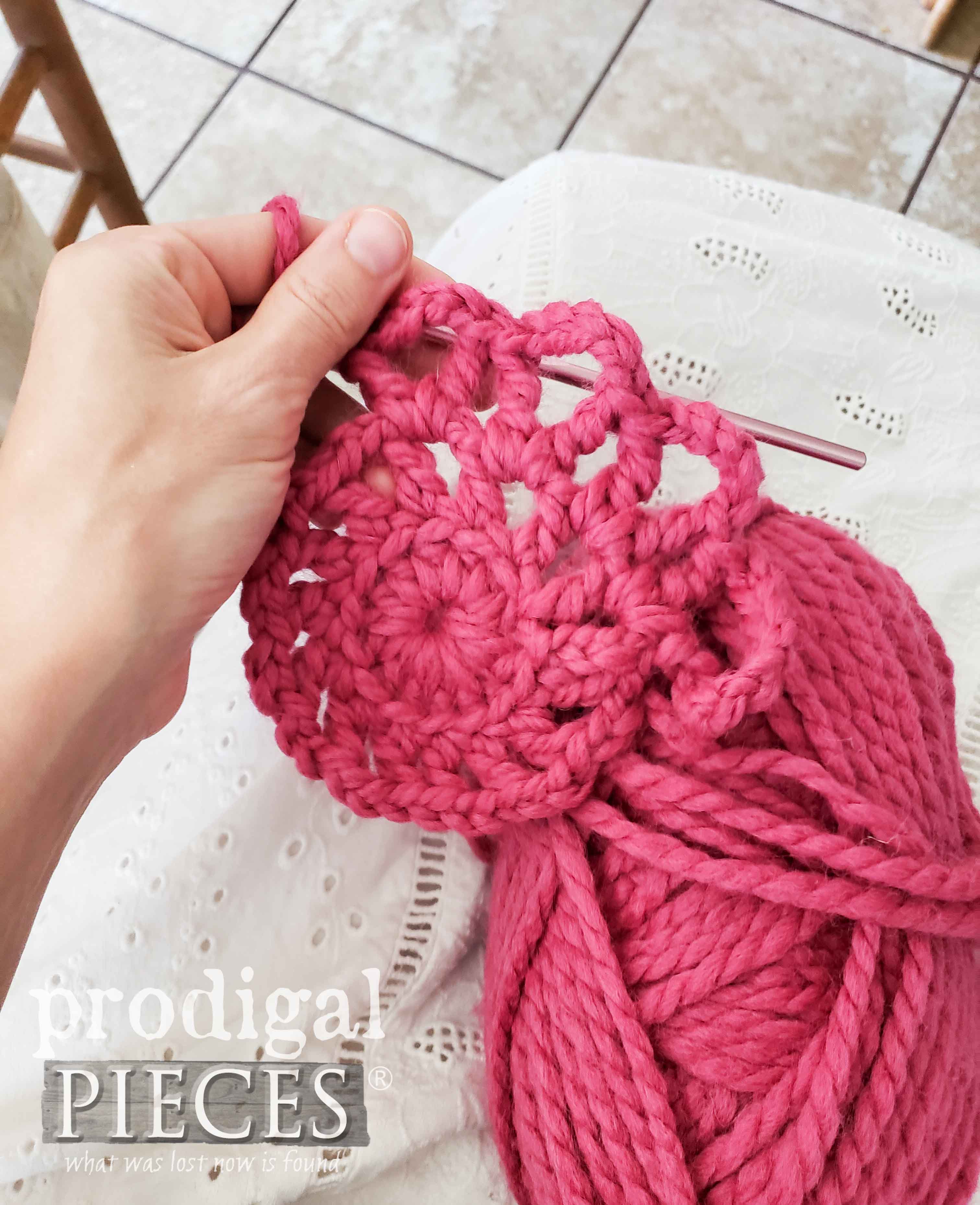 Crocheting Wool Stool Cover in Fuscia by Larissa of Prodigal Pieces | prodigalpieces.com #prodigalpieces #diy #crochet #furniture #home #homedecor