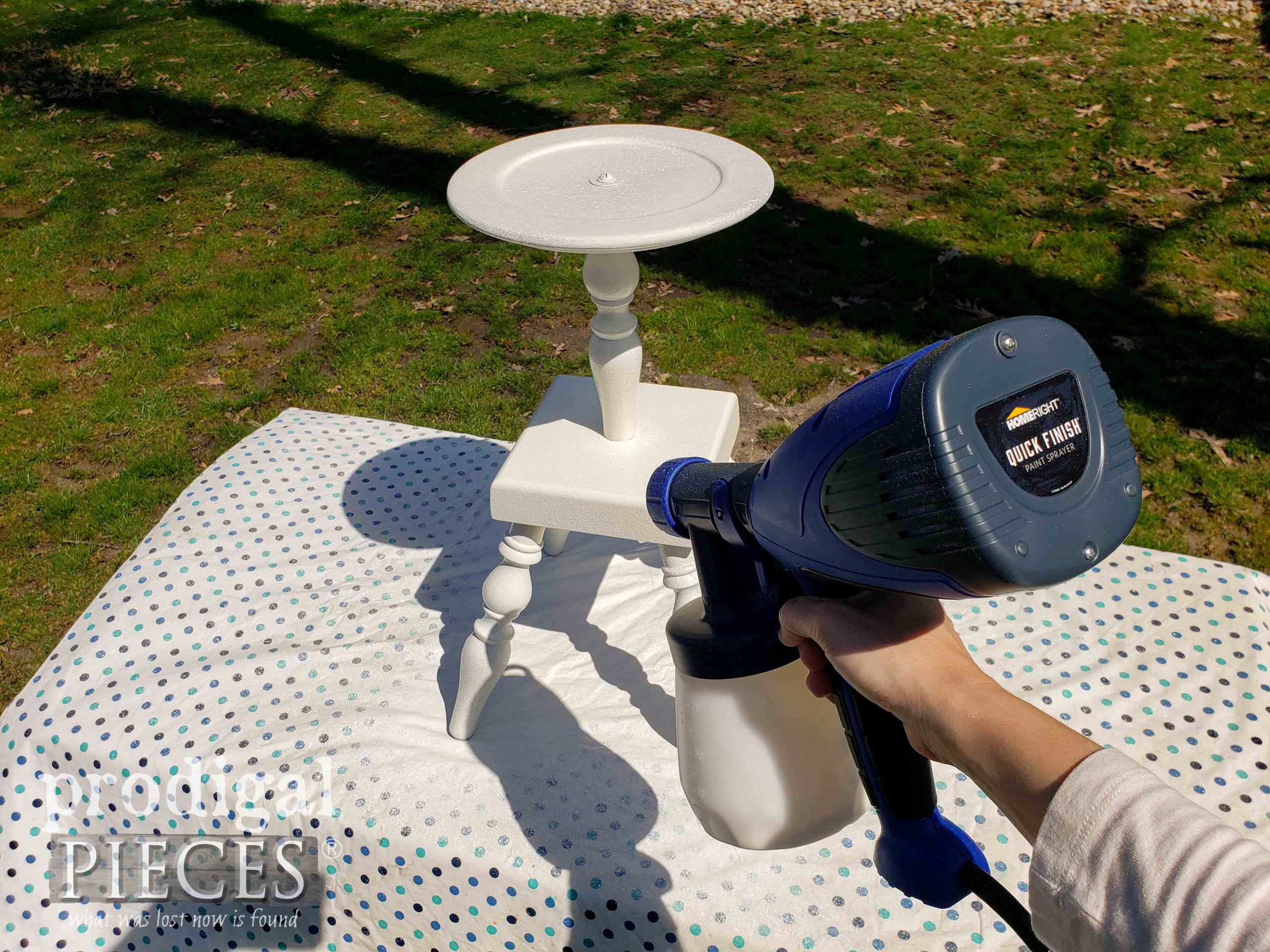 Spraying Upcycled Clock Face Table Base with Paint in HomeRight Quick Finish Sprayer | prodigalpieces.com #prodigalpieces