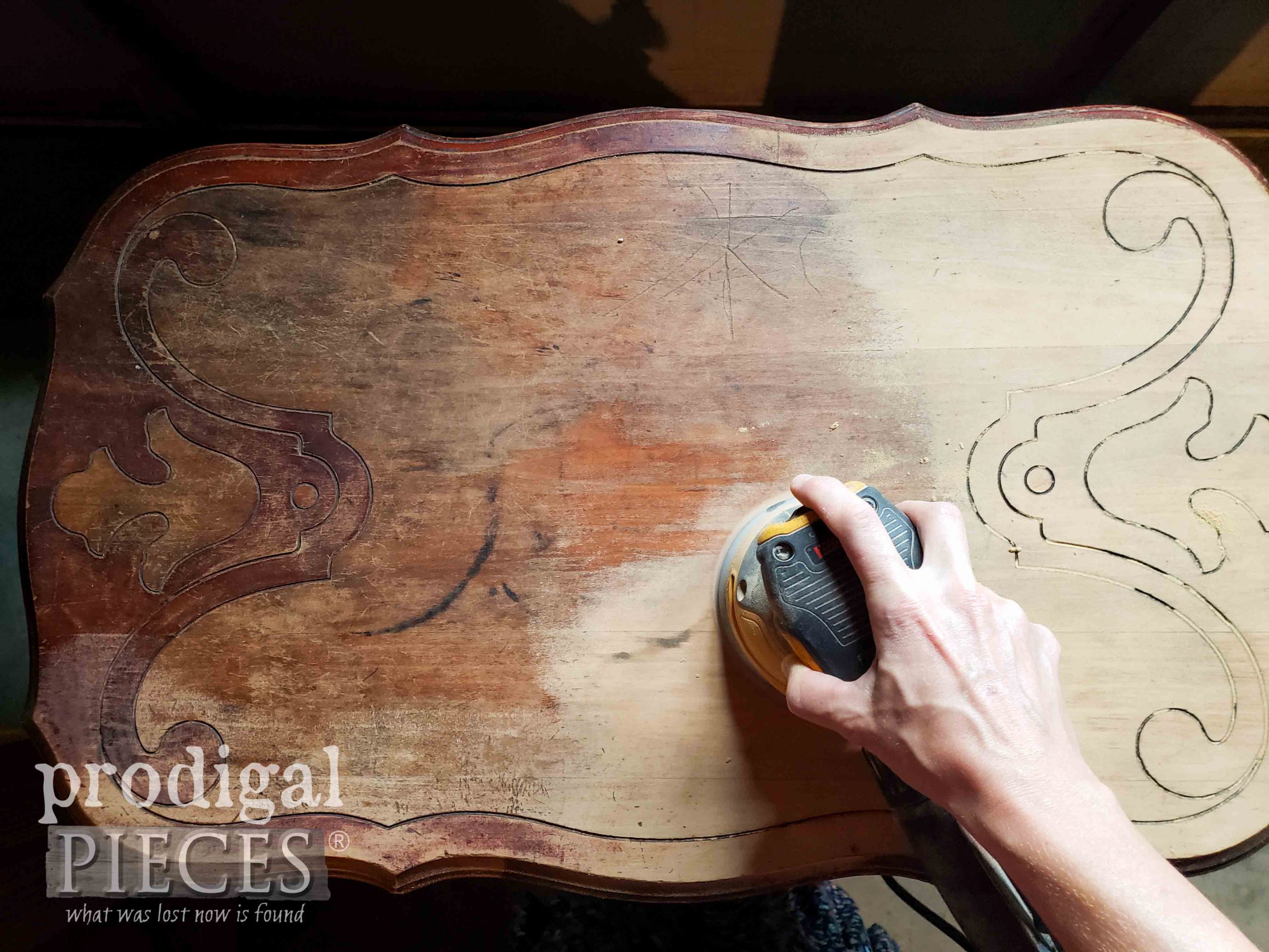 Sanding Ornate Antique Table Top by Larissa of Prodigal Pieces | prodigalpieces.com