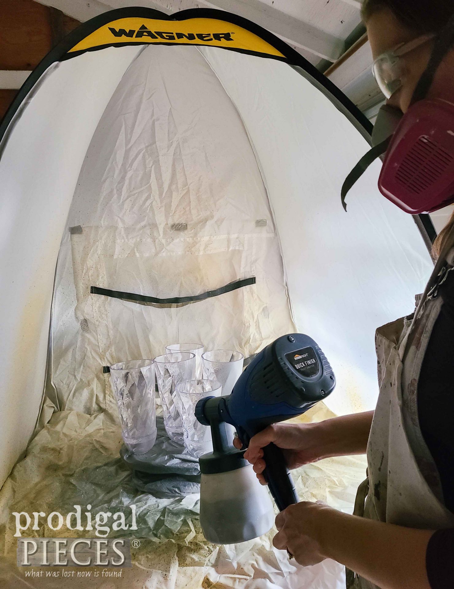 Spray Painting DIY Zinc Bells in Shelter | prodigalpieces.com