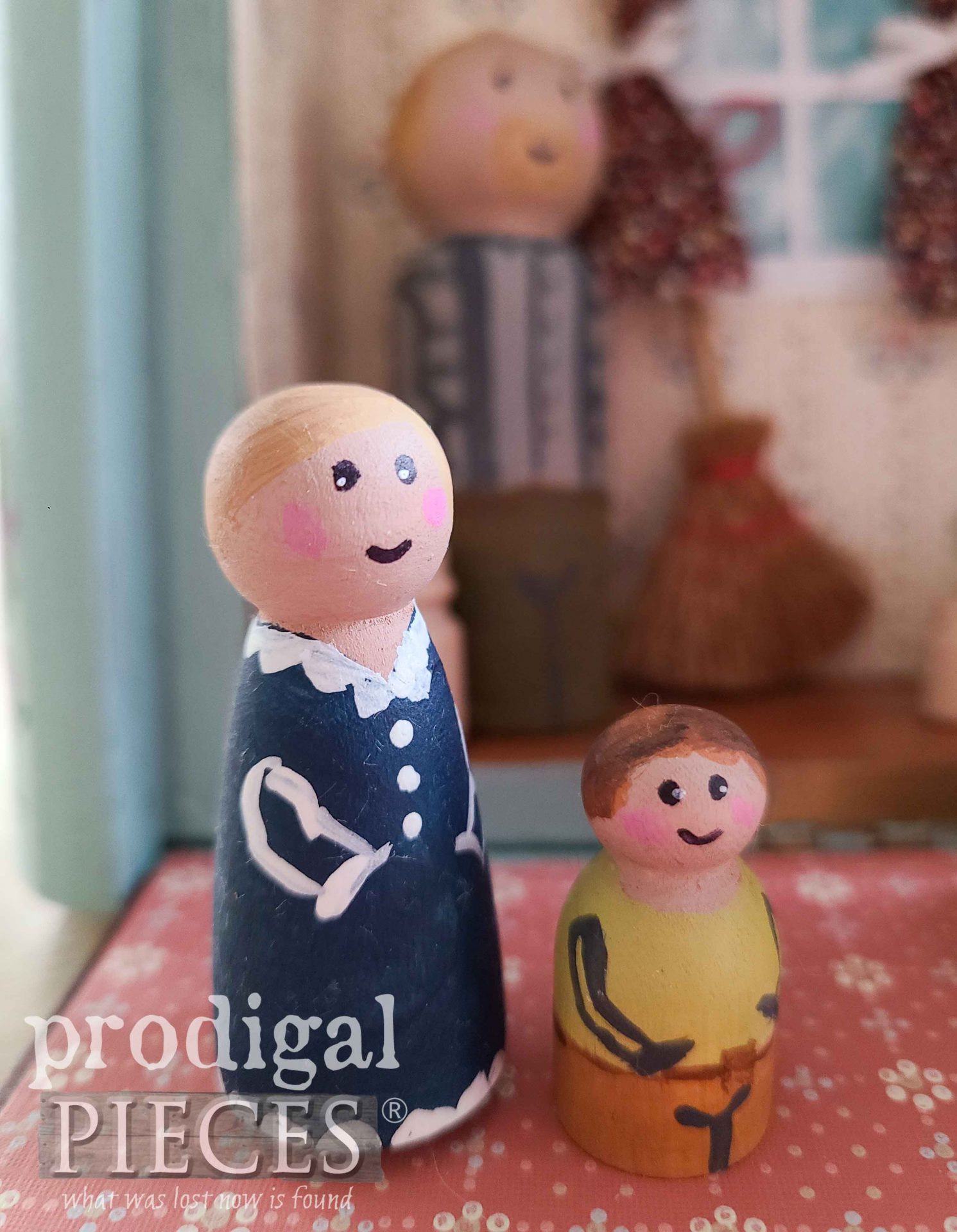 Girl and Boy Peg Dolls in Upcycled Cigar Box Dollhouse by Larissa of Prodigal Pieces | prodigalpieces.com #prodigalpieces #handmade #doll #gift #toys