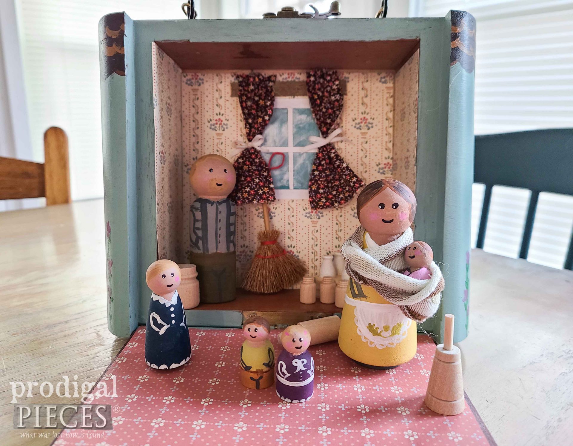 Handmade Peg Doll Family inside Upcycled Cigar Box Dollhouse by Larissa of Prodigal Pieces | prodigalpieces.com #prodigalpieces #dolls #toys #pretendplay