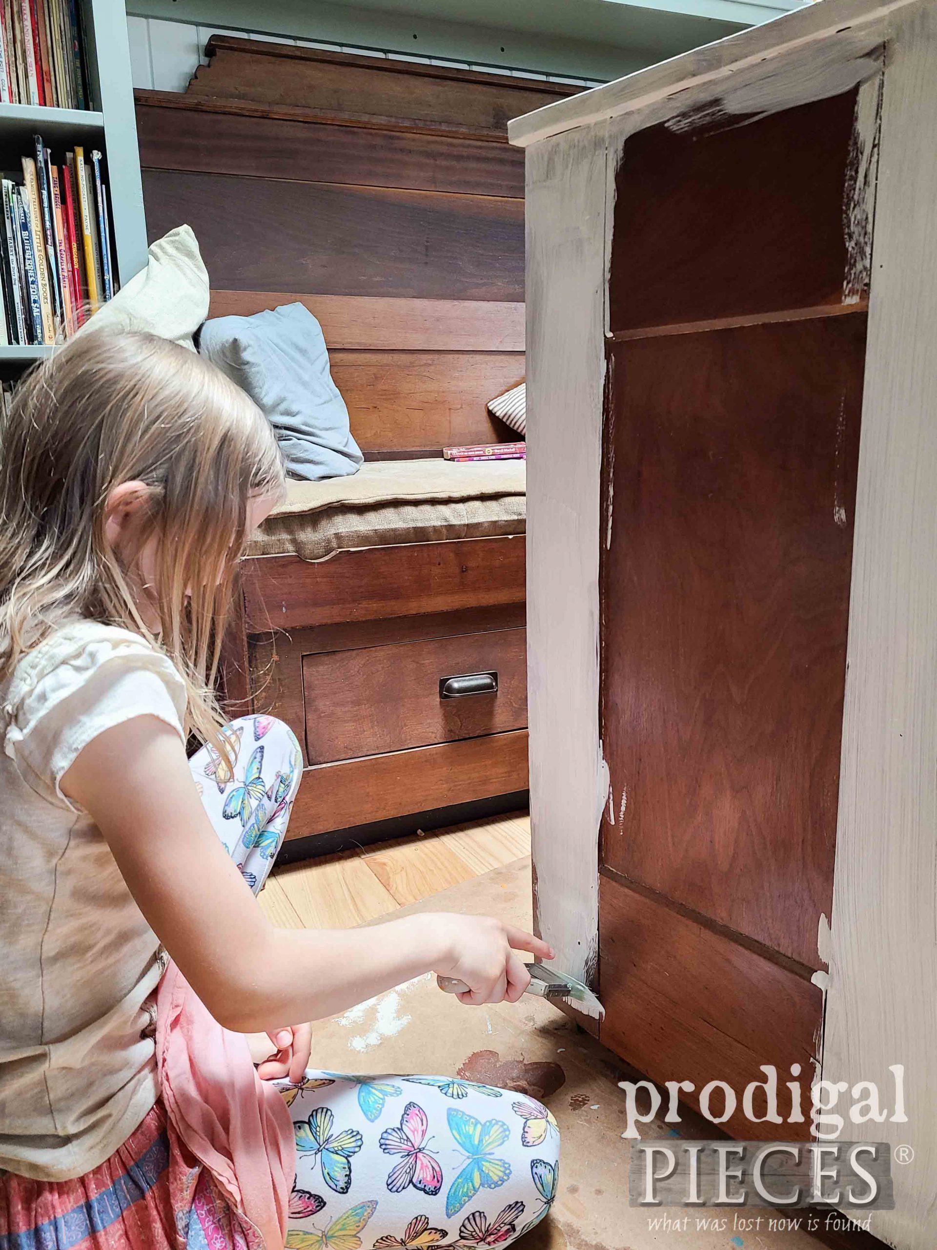 Girl Painting Damaged Chest of Drawers in Soft White Milk Paint | prodigalpieces.com 