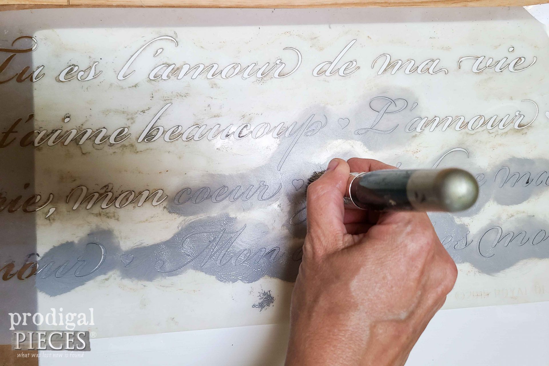 Applying French Script Stencil to Marble Table Top | prodigalpieces.com