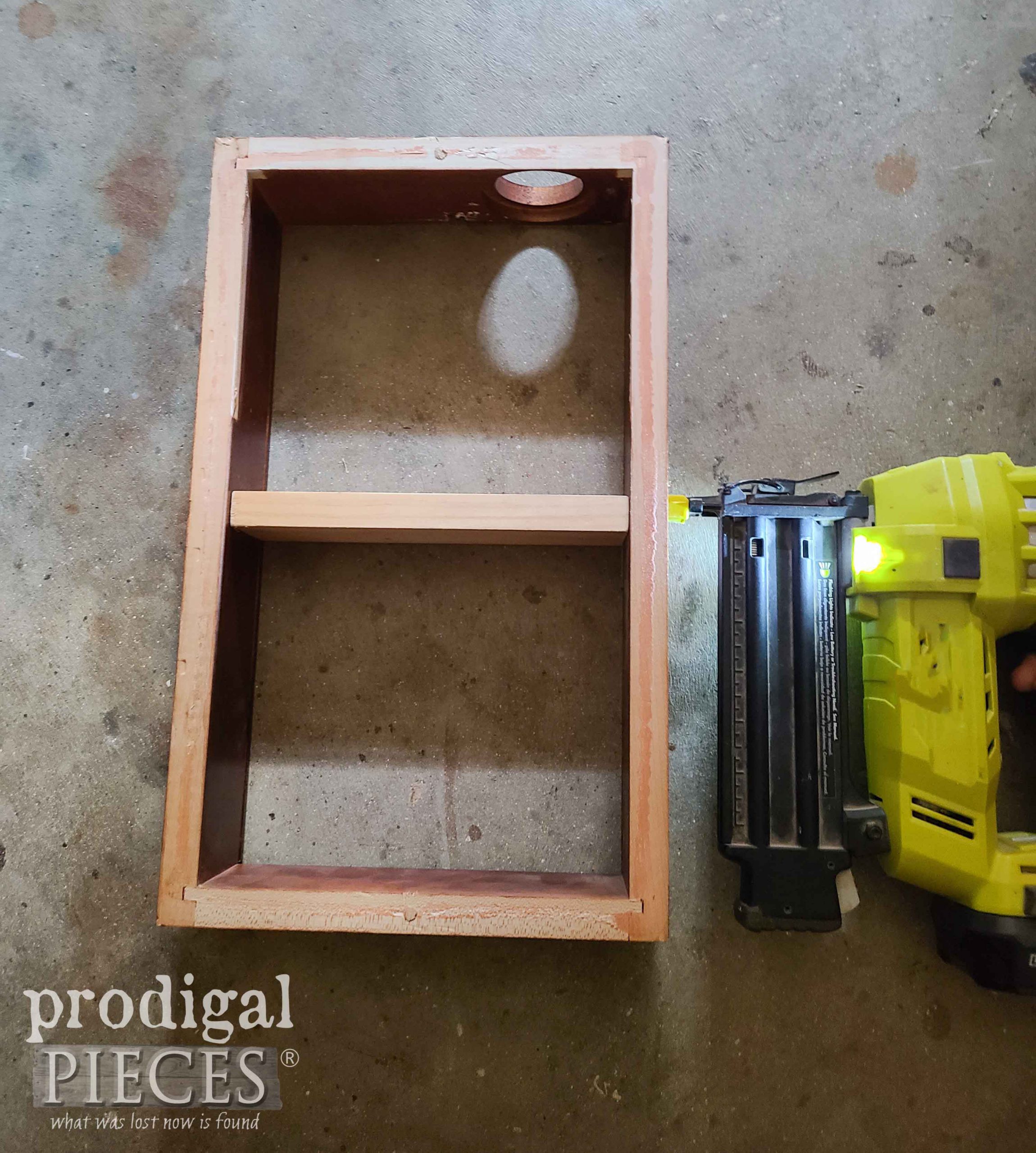 Nailing Cabinet Shelf from Reclaimed Wall Clock | prodigalpieces.com #prodigalpieces