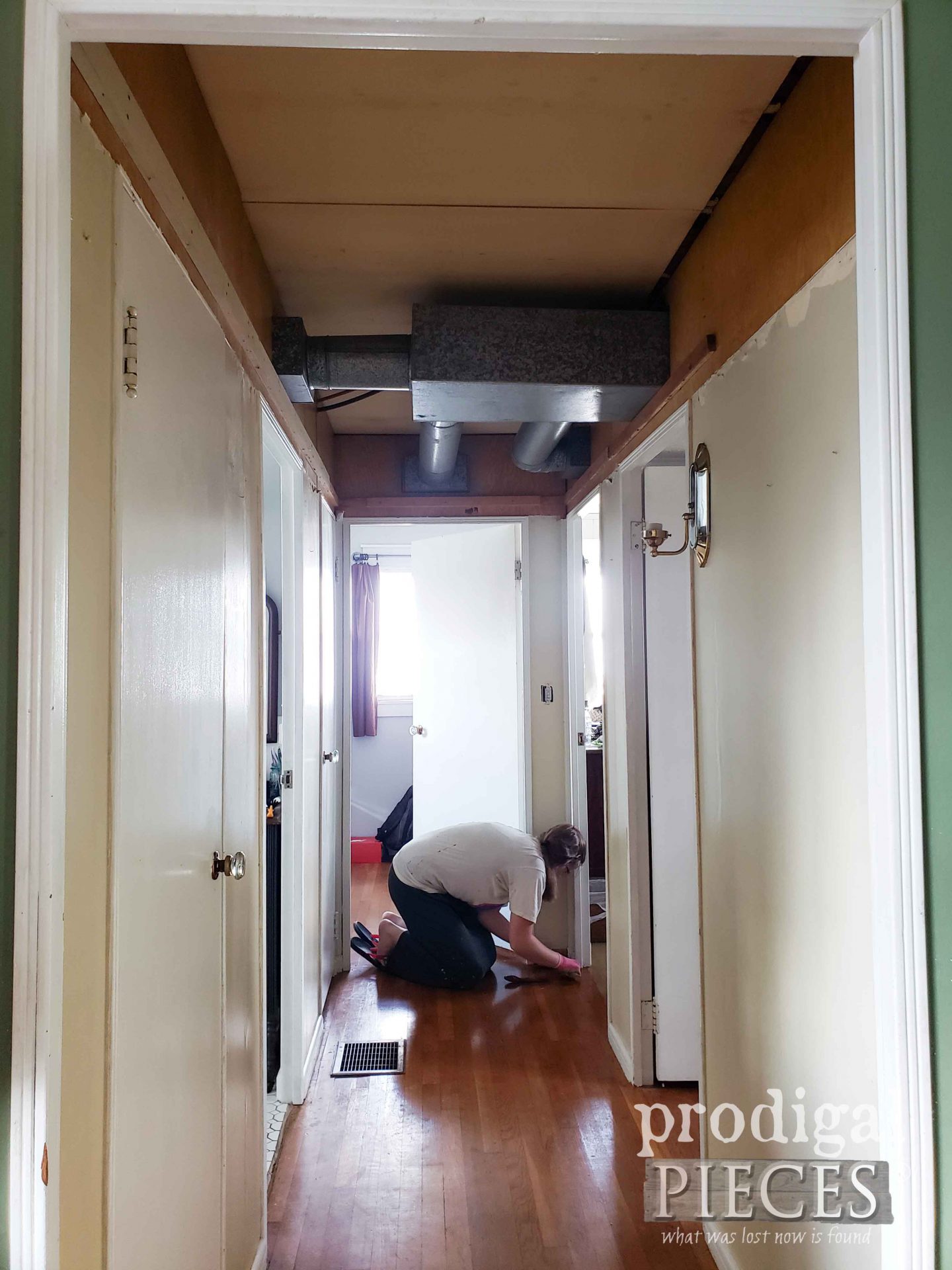 Daughter Helping in Hollow Core Door Hallway Makeover | prodigalpieces.com #prodigalpieces