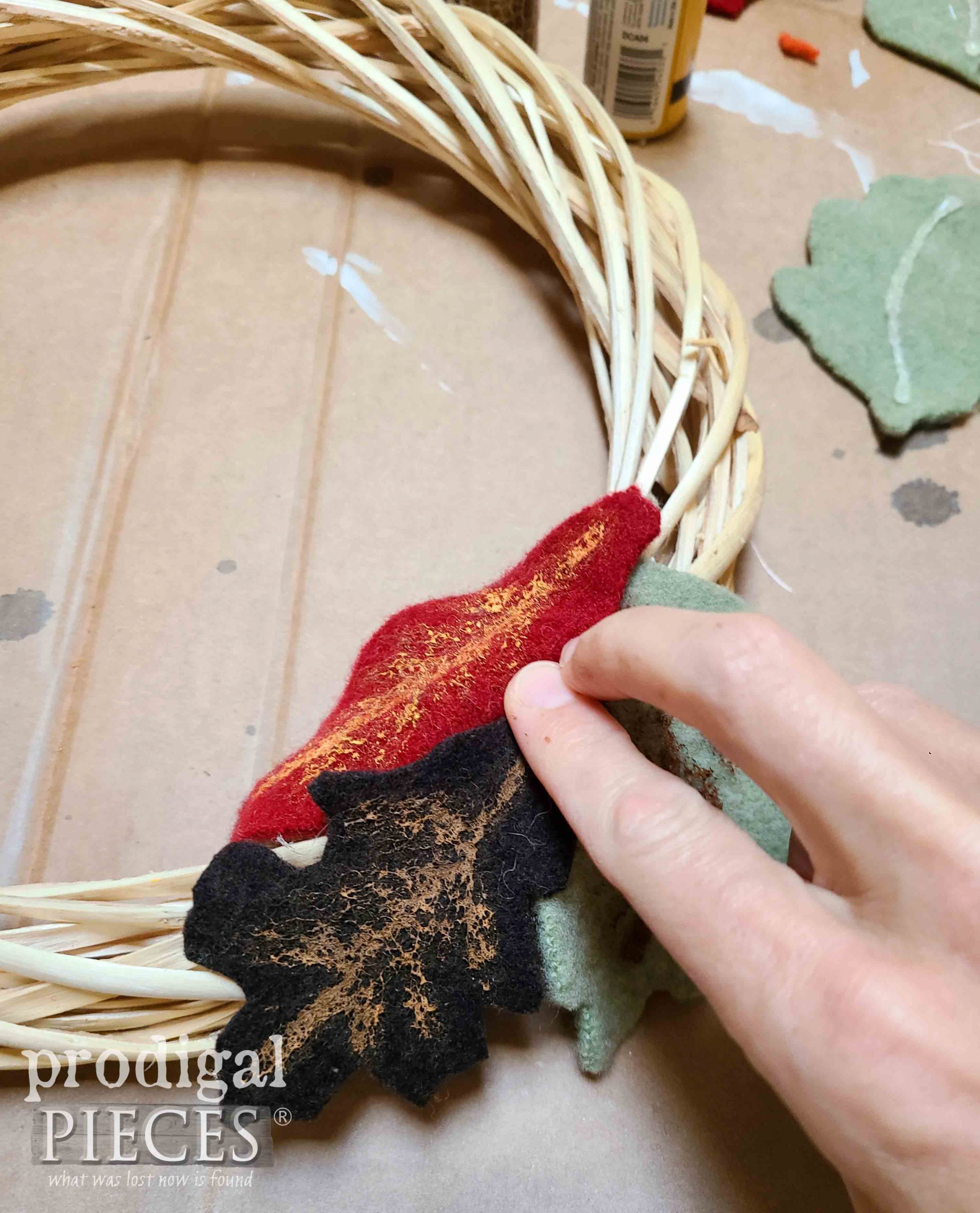 Gluing Felted Wool Sweater Leaved to Fall Wreath | prodigalpieces.com #prodigalpieces