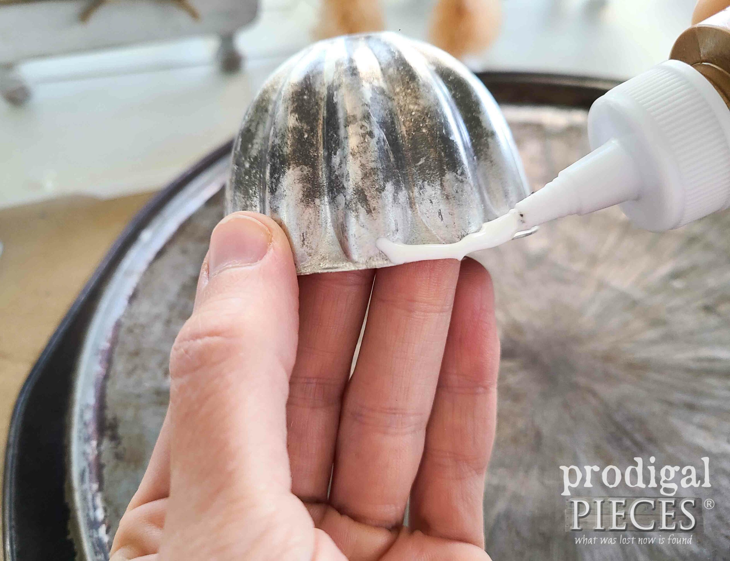 Applying Tacky Glue to Vintage Jello Mold for Repurposed Christmas Ornaments | prodigalpieces.com #prodigalpieces