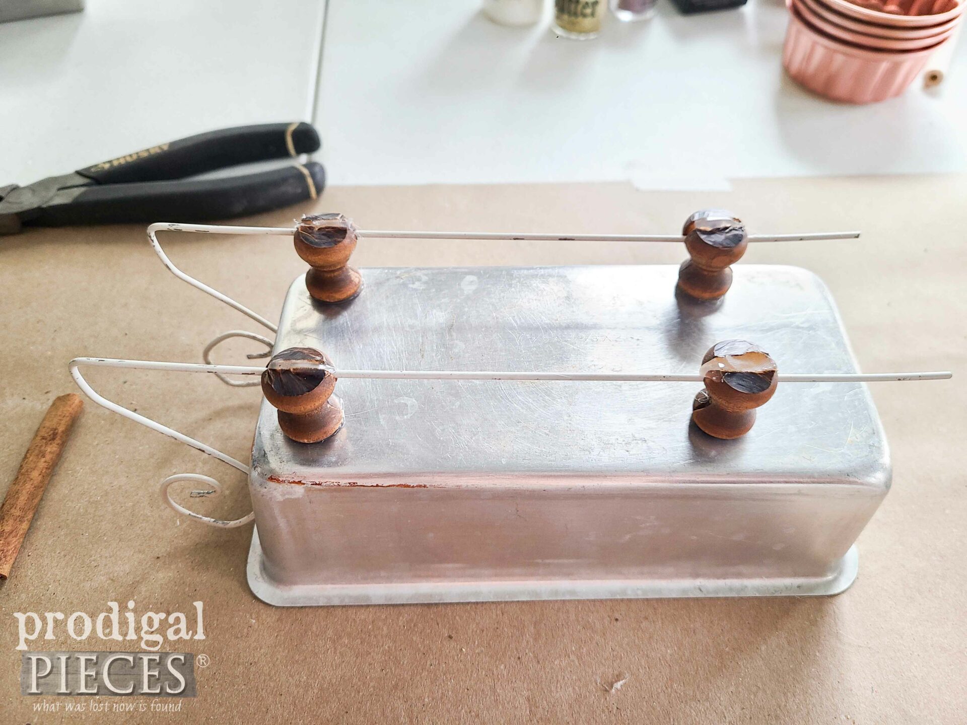 Repurposed Bread Pan Bottom with Wire Hanger Runners | prodigalpieces.com #prodigalpieces