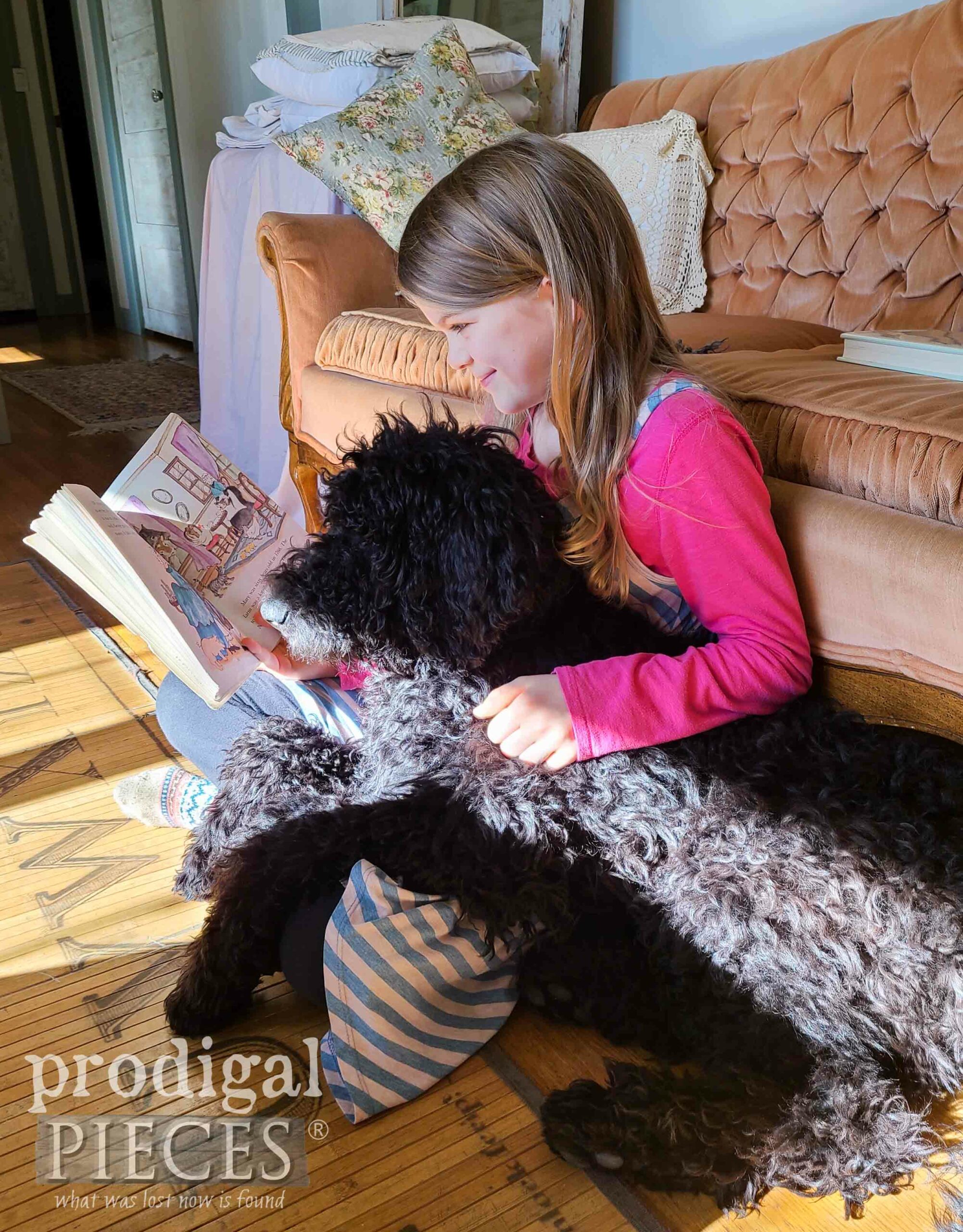 Girl Reading Book to Goldendoodle Puppy | prodigalpieces.com #prodigalpieces #puppy #goldendoodle