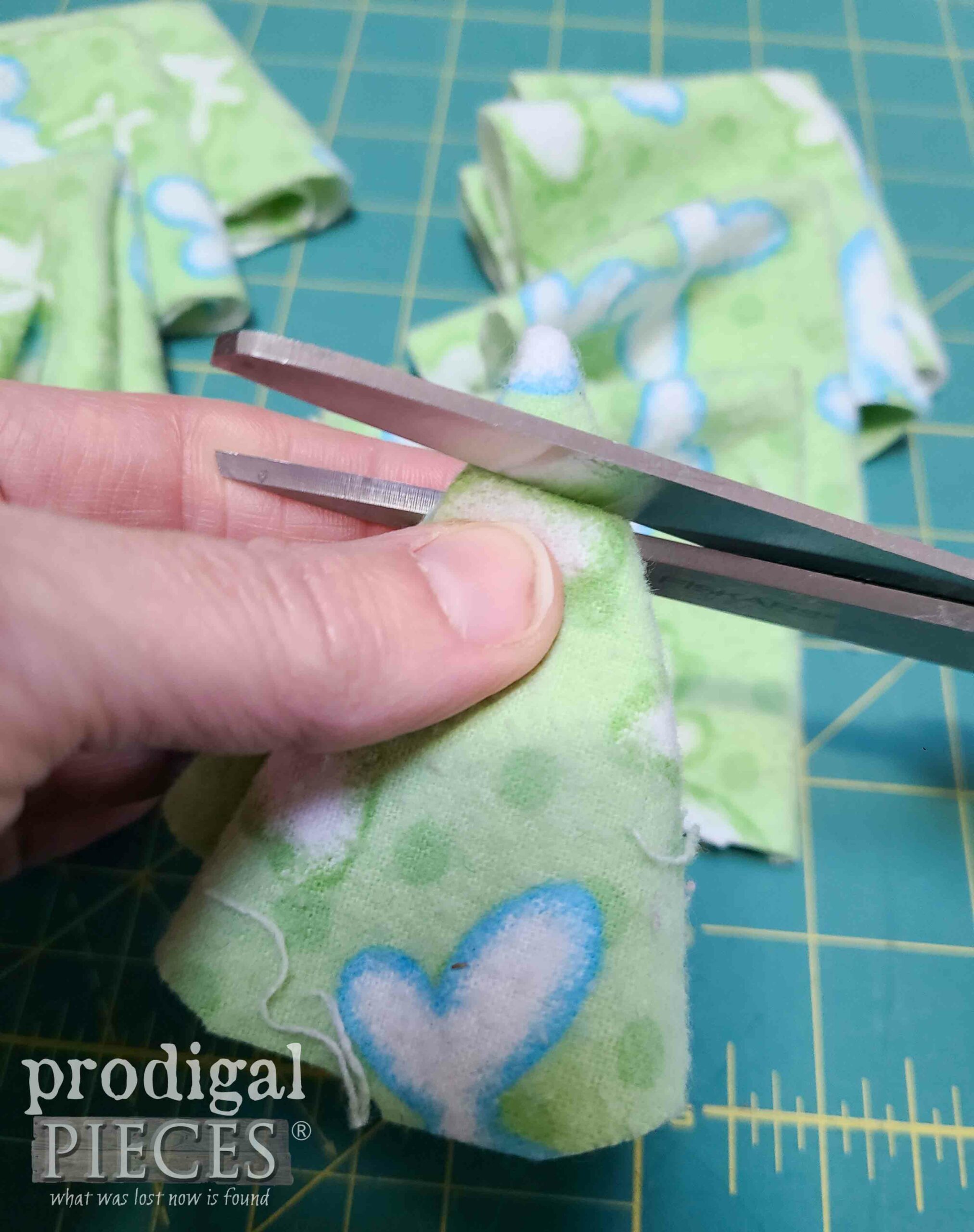 Snipping Hole in Flannel Fabric for DIY Dog Snuffle Board Toy | prodigalpieces.com #prodigalpieces