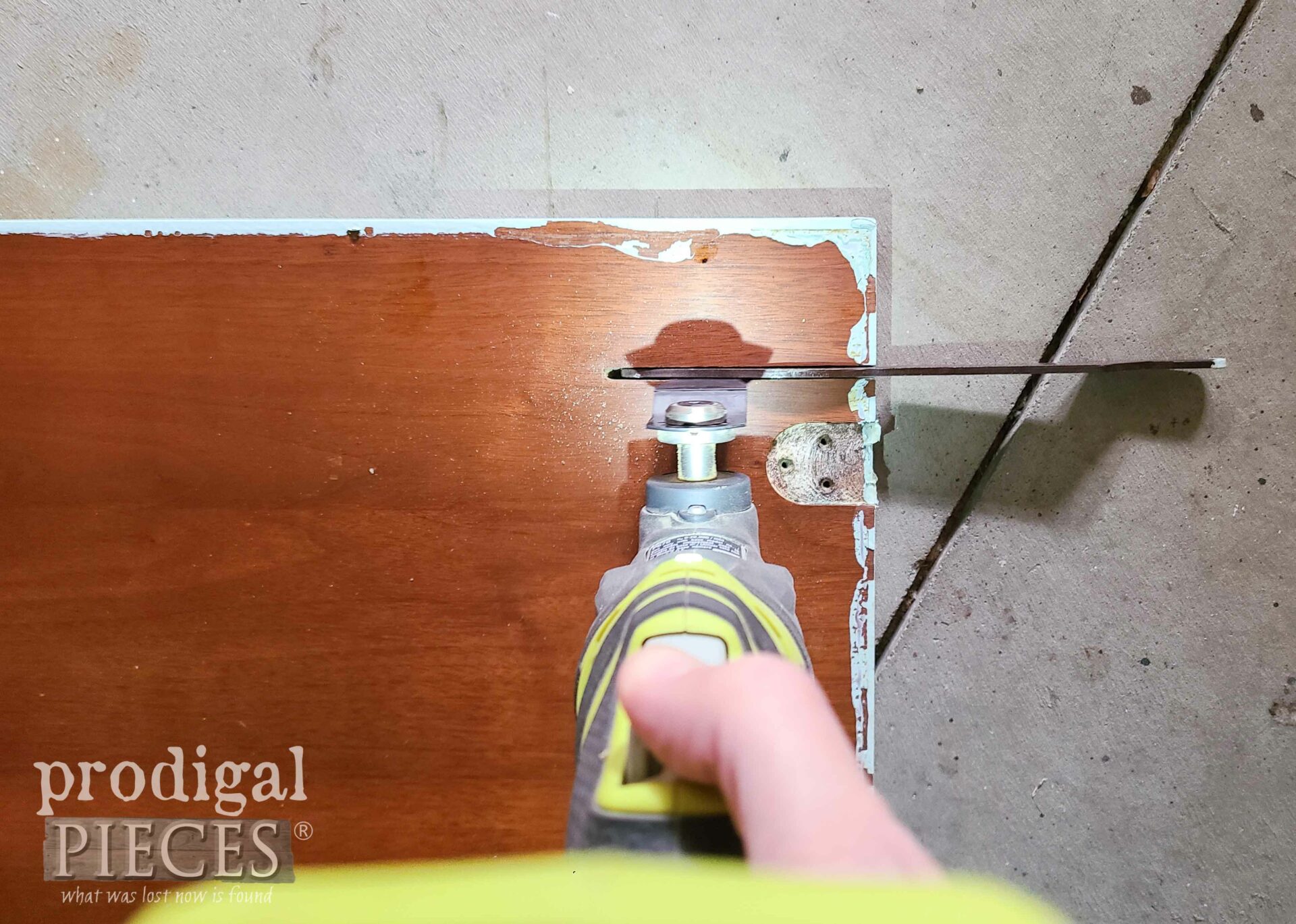 Cutting Hardware on Reclaimed Sewing Machine Table Top | prodigalpieces.com #prodigalpieces