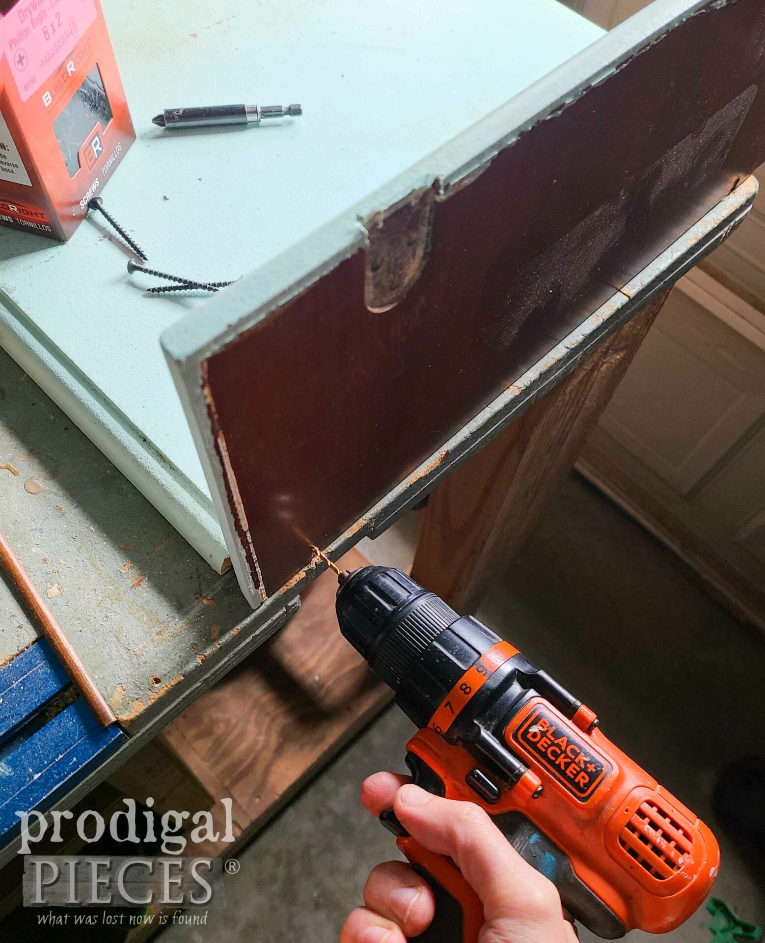 Drilling Repurposed Shelf from Reclaimed Sewing Machine Table Top | prodigalpieces.com #prodigalpieces