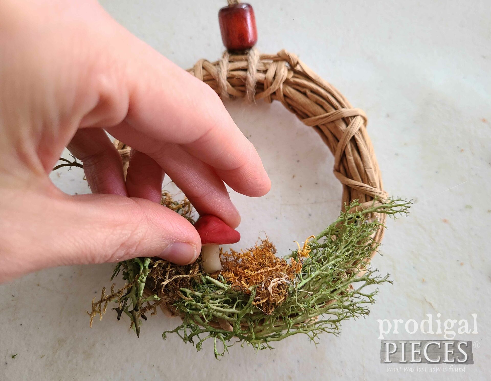 Gluing Clay Mushroom onto Mini Wreath | prodigalpieces.com #prodigalpieces