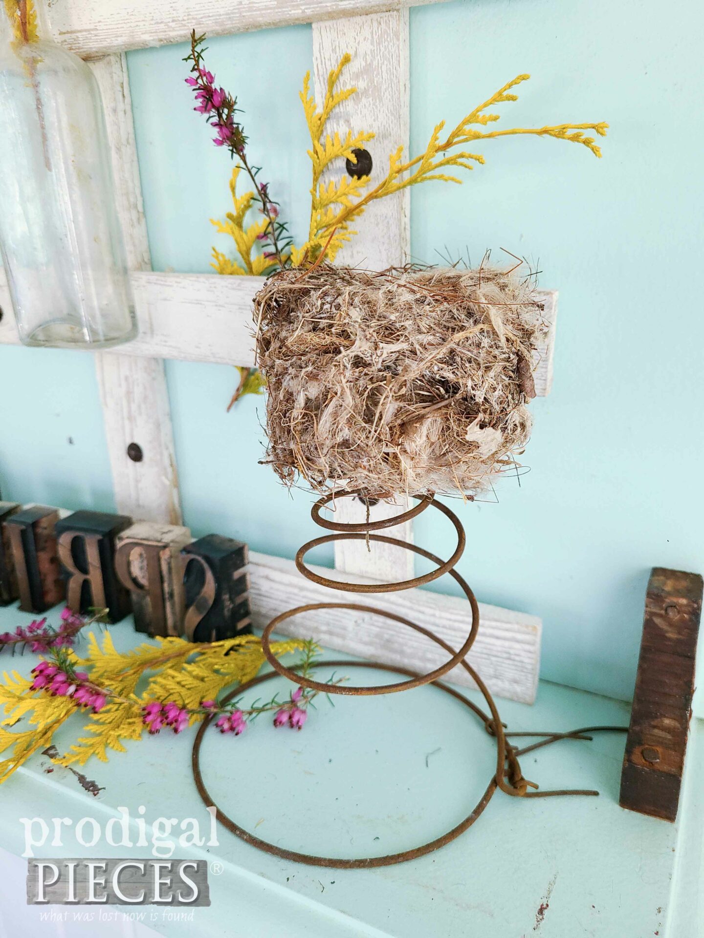 Rusty Spring with Bird Nest on Repurposed Sewing Machine Table Top by Larissa of Prodigal Pieces | prodigalpieces.com #prodigalpieces #sewing #repurposed