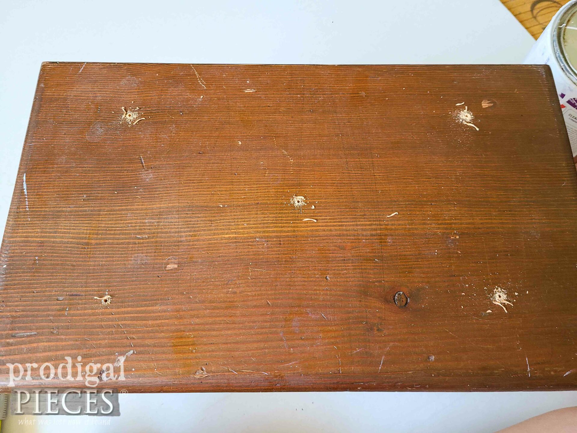 Drilled Button Holes for Tufted Footstool | prodigalpieces.com #prodigalpieces