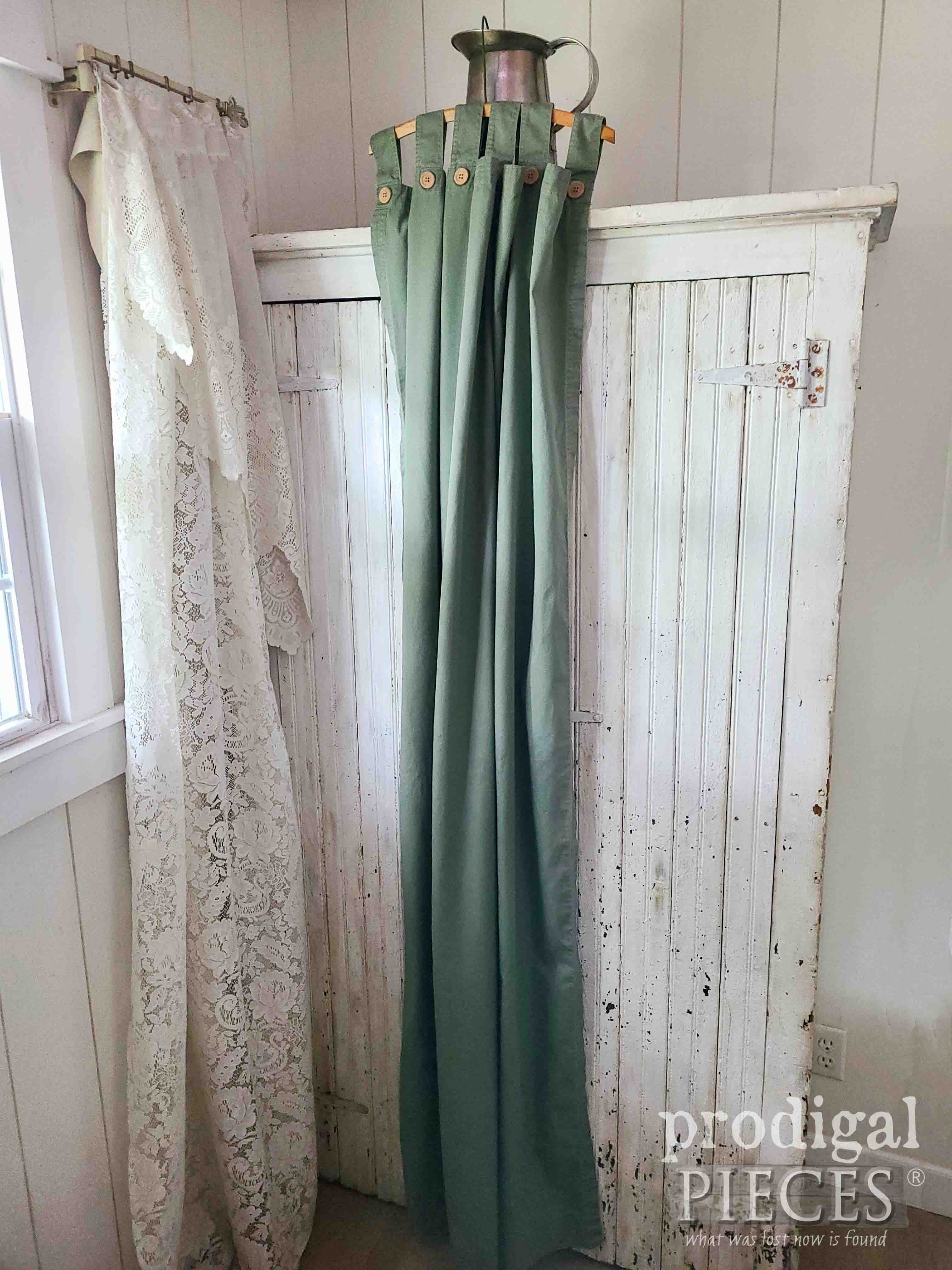 Hanging Thrifted Green Curtain Before Upcycle into DIY Cargo Pants | prodigalpieces.com #prodigalpieces